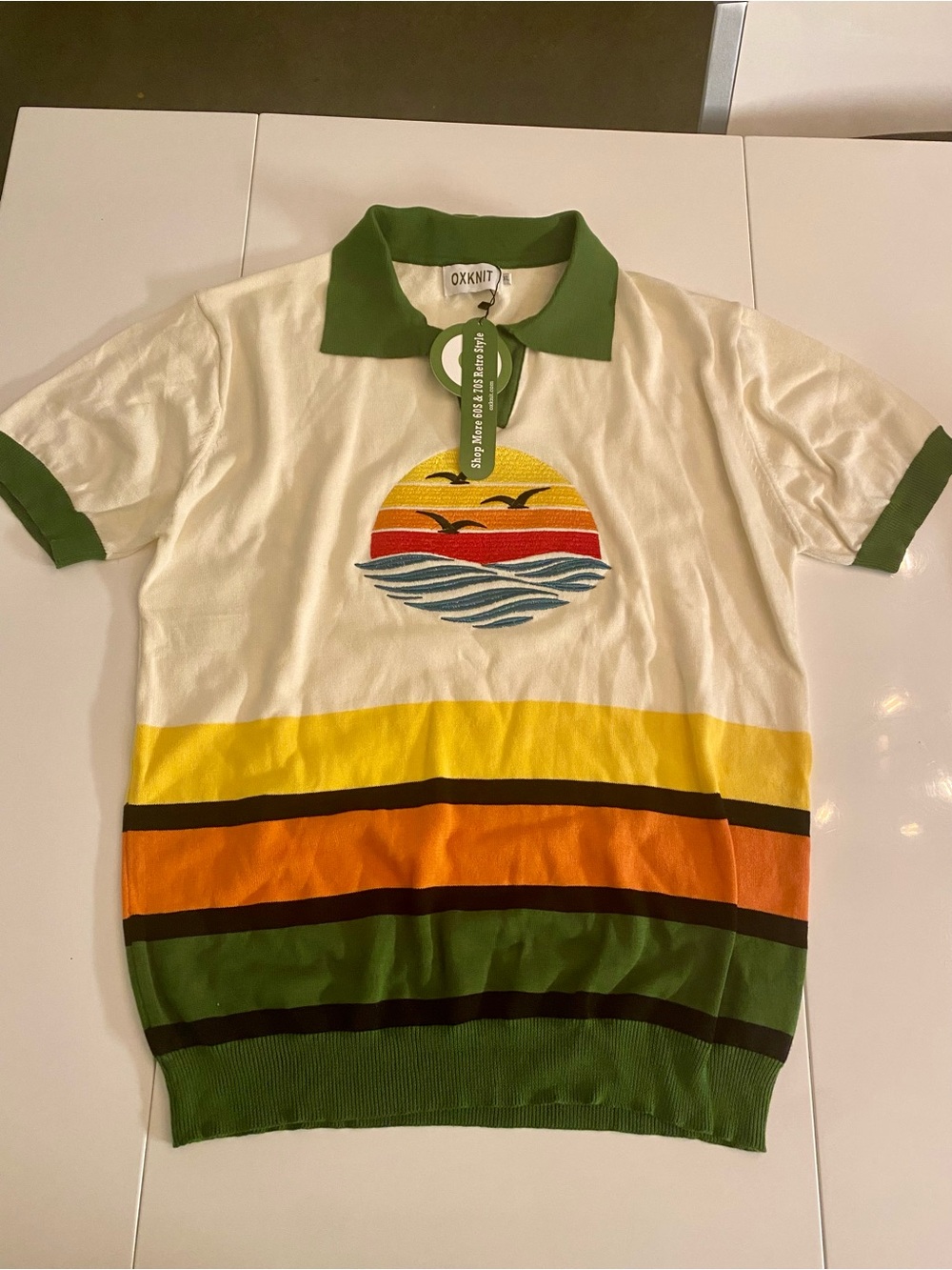Retro Cream Polo with Green Trim & Sunset Stripe Motif